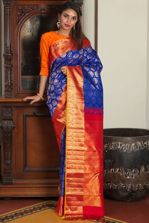 image of royal blue with silver zari worked red border 